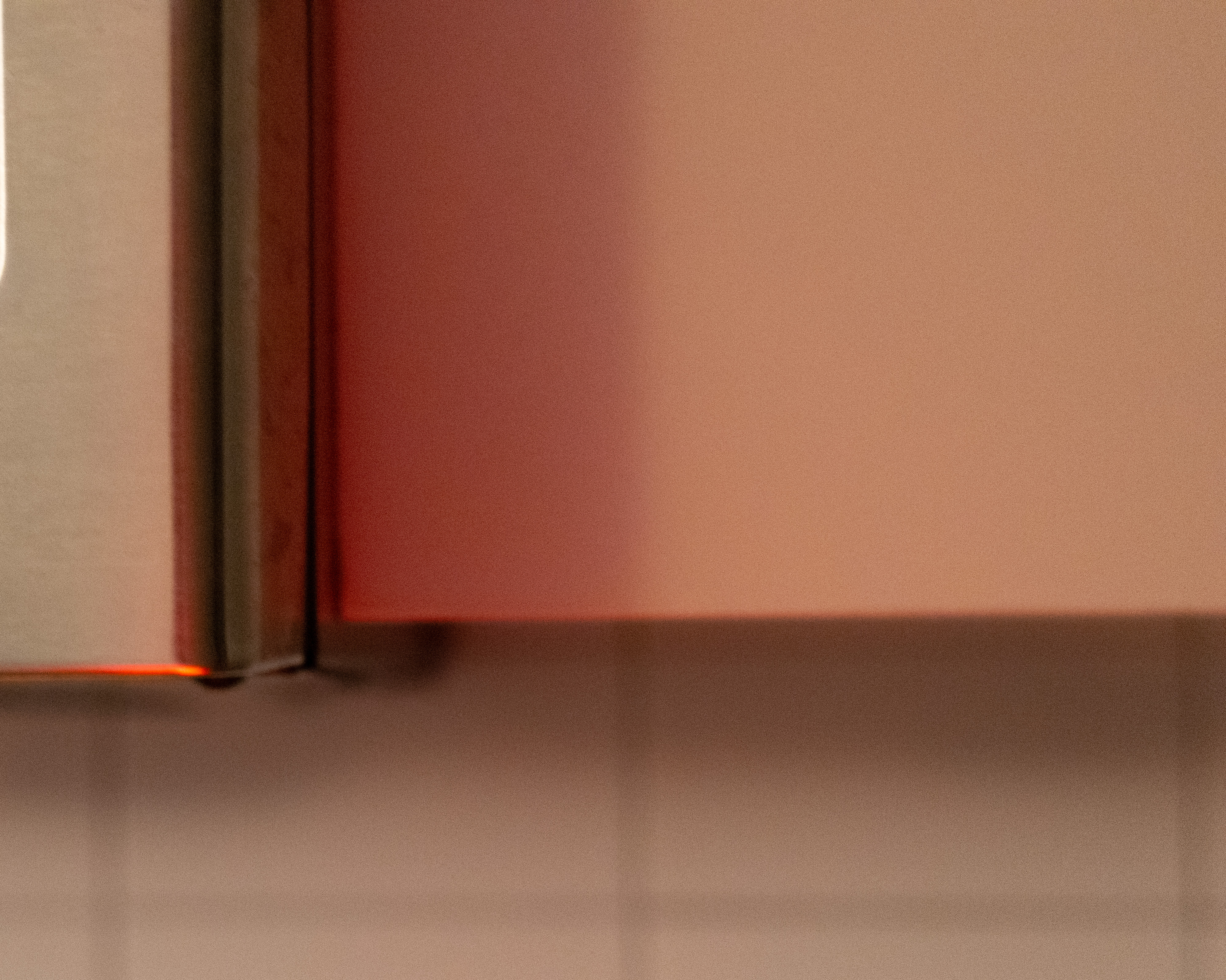 Abstract interior surface with warm shadow and magenta light