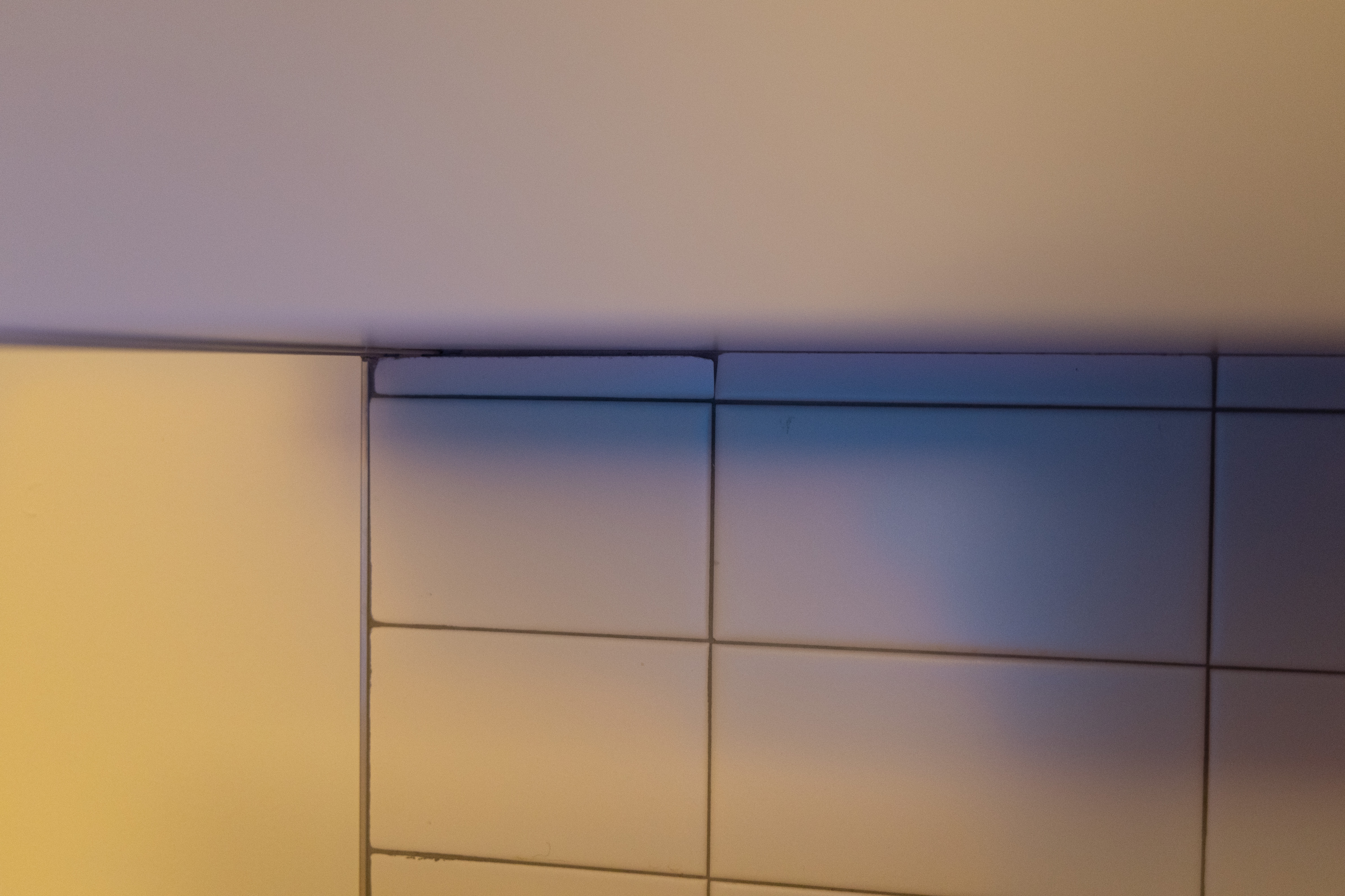 Warm orange interior corner photographed as an abstract color field