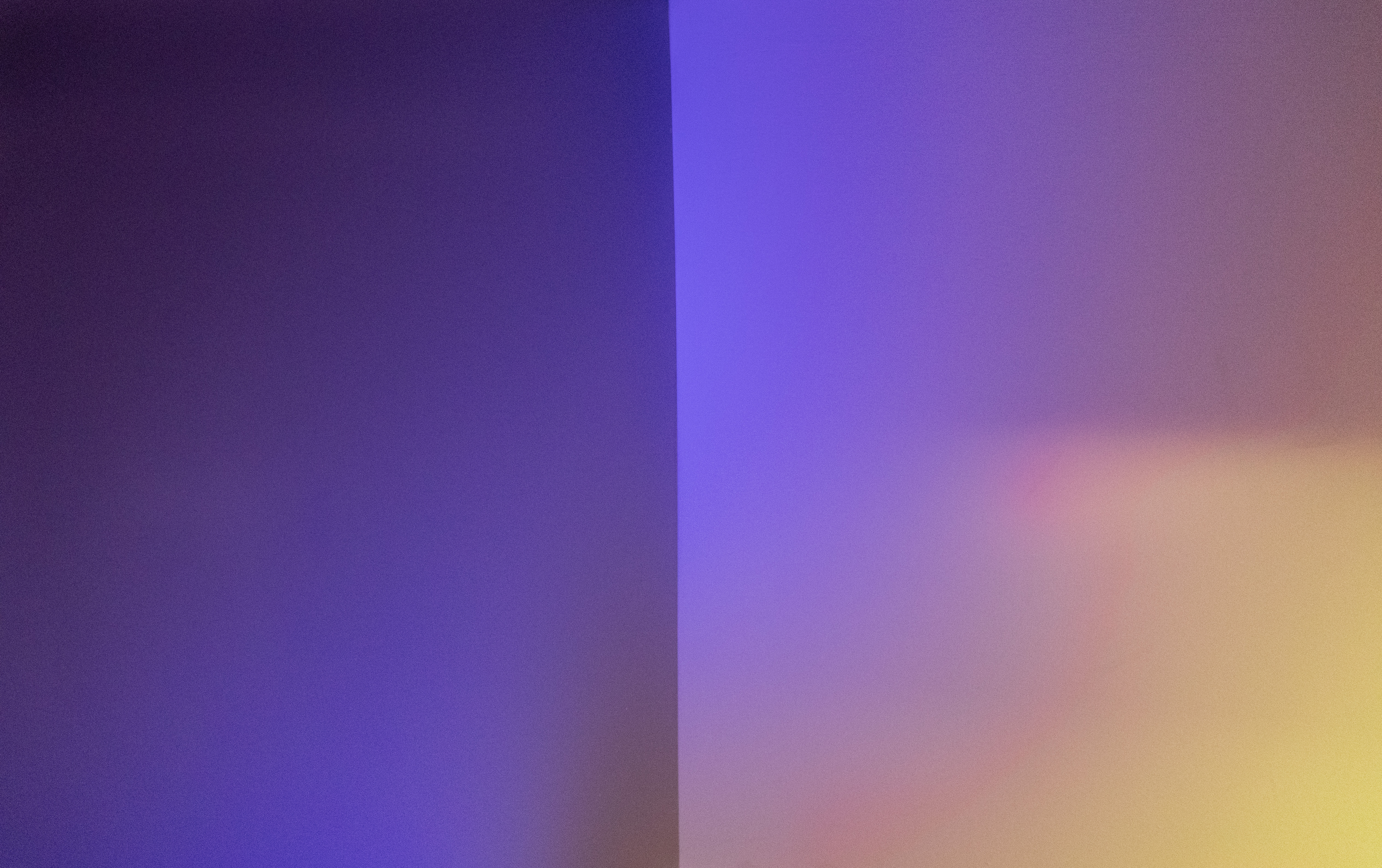 Warm light cast across an interior corner